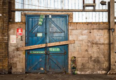 A barred door in a warehouse