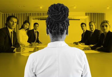 A Black female academic being scrutinised in a meeting.