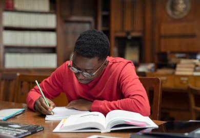 A black student studies in a university library