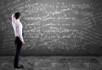 Blackboard covered in maths equations