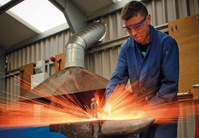 Blacksmith hitting anvil