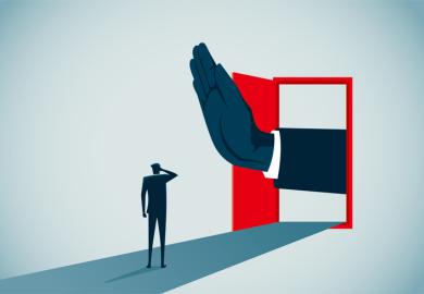 A hand blocks a door, symbolising restricted university access