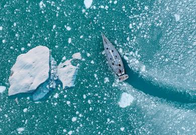 Boat changing course to avoid iceberg, illustrating scientific course correction.