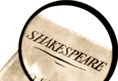 Book by Shakespeare under a magnifying glass