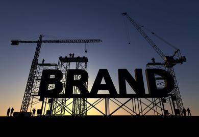 A giant sign reading "Brand" on scaffolding