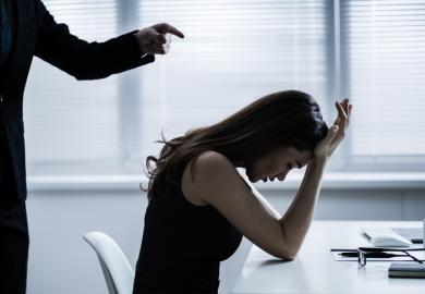 A boss bullies a female employee