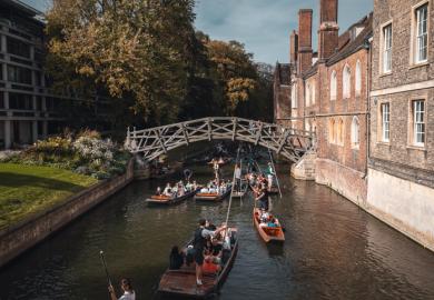 Punting on a crowded river in Cambridge, illustrating bullying and precarity