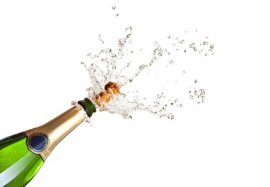 Cork popping on a champagne bottle