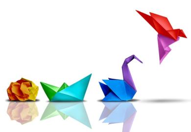 A ball of paper turns into an origami bird, illustrating successful change