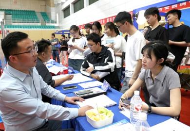 Students queue up at a job fair in China