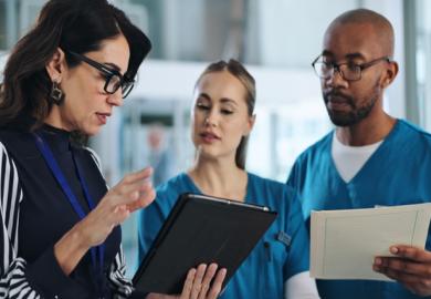 Medical scientists discuss results, illustrating clinical trials