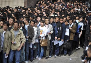 Crowd of graduates waiting for job fair, China
