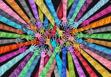 Multicololoured hands overlapping, symbolising DEI