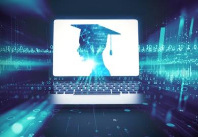 A computer with a mortarboard on the screen, symbolising teaching data