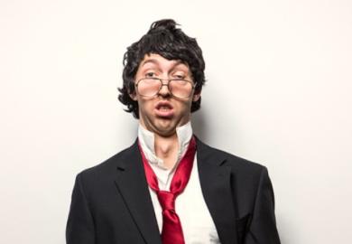 A dishevelled man in a suit