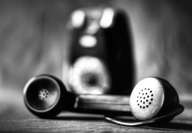 An old-fashioned phone in black and white
