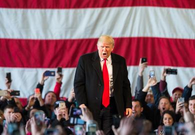 Donald Trump speaks in front of a crowd