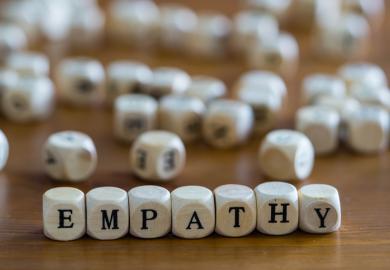 Dice spell out the word "empathy"