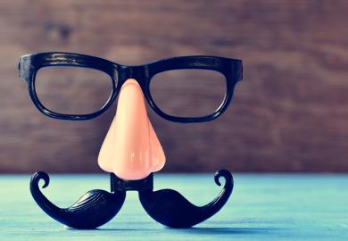 Fake nose and moustache eye glasses placed on table