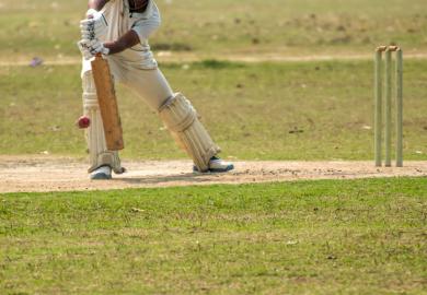 An Indian cricketer plays a defensive shot