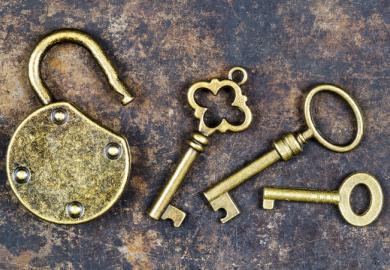 Golden keys to an open gold padlock, symbolising gold open access
