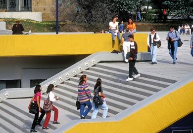 Students walking up stairs on campus