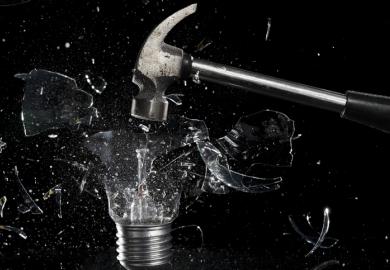 A hammer smashes a lightbulb