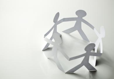 Paper people in a circle, symbolising human connection