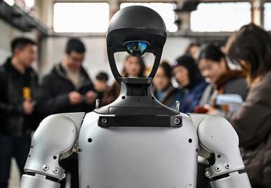 People stand next to a humanoid robot during the Global Developer Conference, organised by the Shanghai AI Industry Association, in Shanghai on 21 February 2025