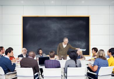 Students gathered around professor