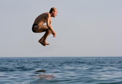 Man jumping into water