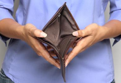 Person holding an empty wallet