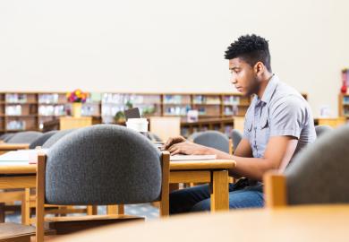 Black student in university library