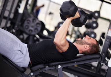 Man lifting weights in gym