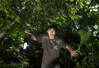 A man looking fearful in the jungle, illustrating visceral fear