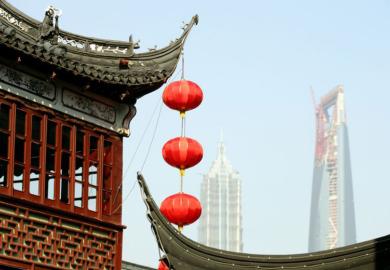 Red lanterns hanging from a temple roof in Shanghai