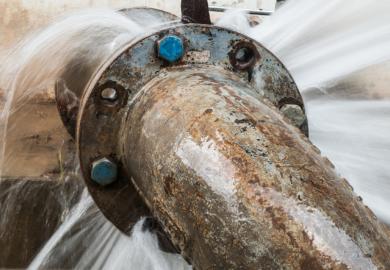 A pipleine with water leaking out of it, symbolising the loss of women from engineering