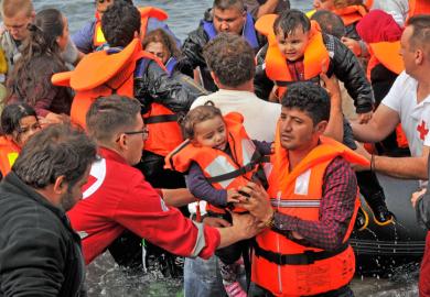 Volunteer rescuers helping refugees on Lesvos in Greece