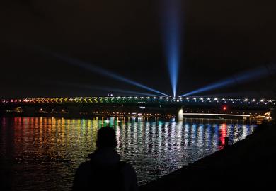 lights reflecting in water at night