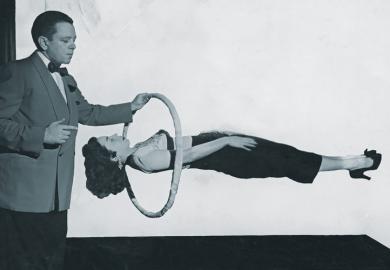 Magician performing gravity-defying trick