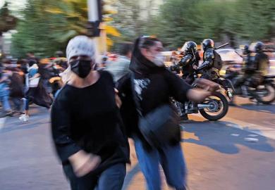 People gather during a protest for Mahsa Amini, who died after being arrested by morality police allegedly not complying with strict dress code in Tehran, Iran on September 19, 2022