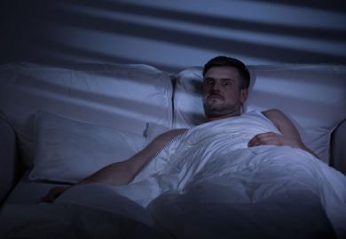 man-awake-in-bed