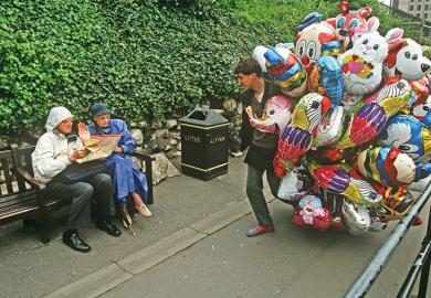 Man with lots of balloons