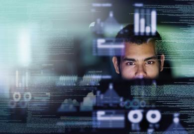 Man working with data on screen