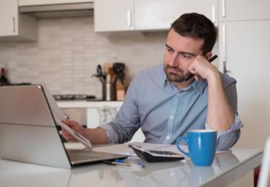 Man frustrated by paperwork