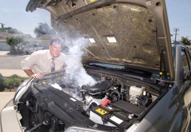 Man with overheating car
