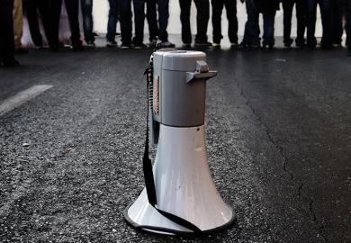 Megaphone on road in front of crowd of people