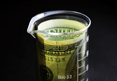 Money in a scientific vessel, illustrating the cost of scientific publication