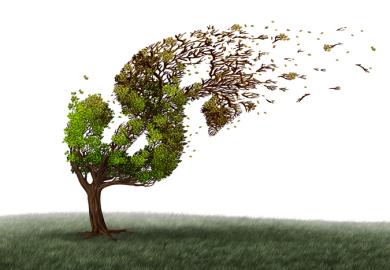 A tree in the shape of a dollar sign sheds its leaves