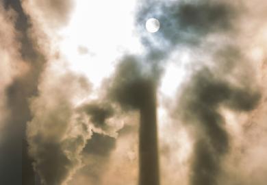 Moonlit sky behind clouds of smoke